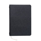The Pensift leather cover in black Epsom-grain leather, front-on, with the beige ribbon.