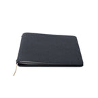 A closed Pensift Notebook in black Italian Epsom leather, showing its minimalist exterior and slim profile.