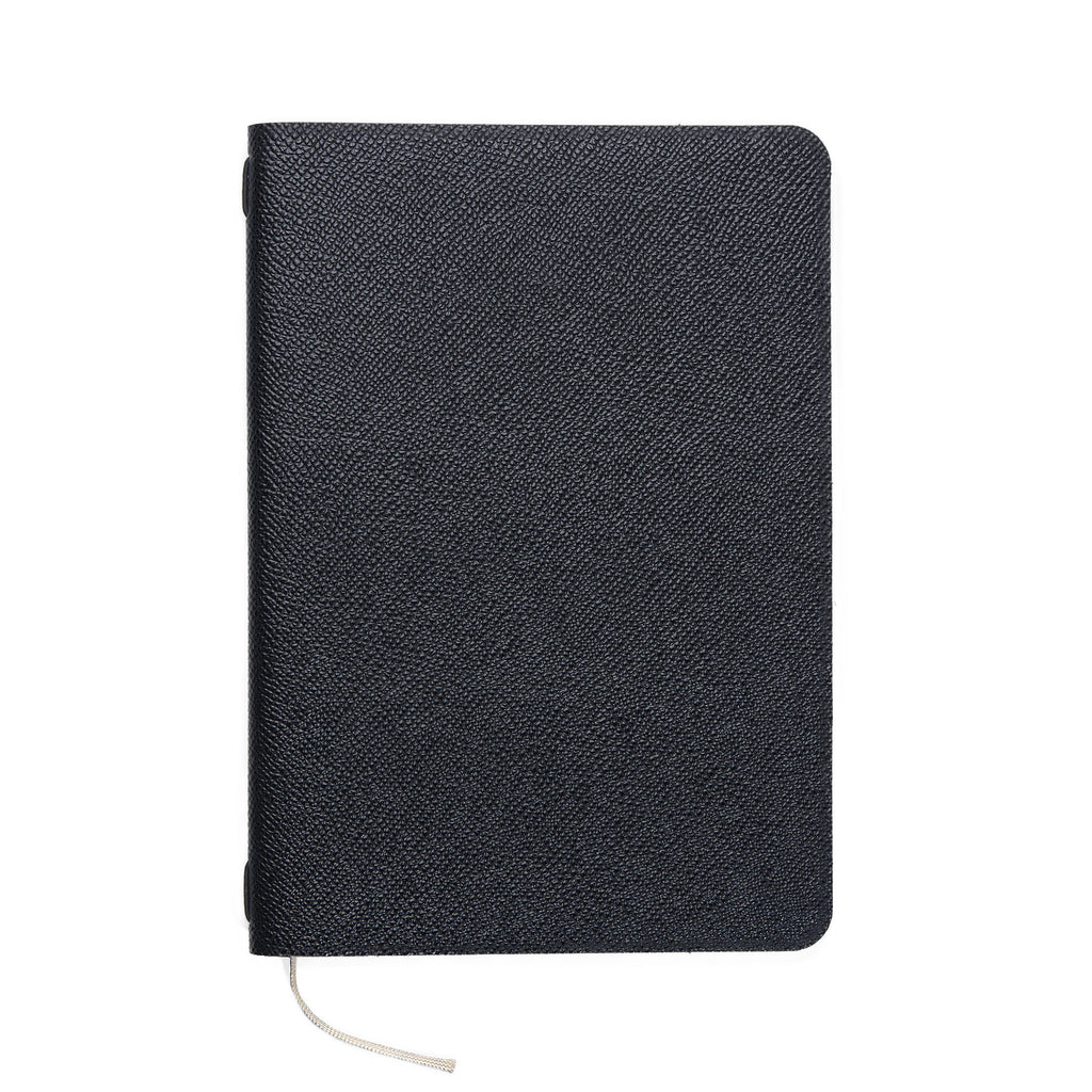 A top-down view of the closed Pensift Notebook, highlighting the fine cross-hatched grain of the black Italian Epsom leather and its completely unbranded exterior.
