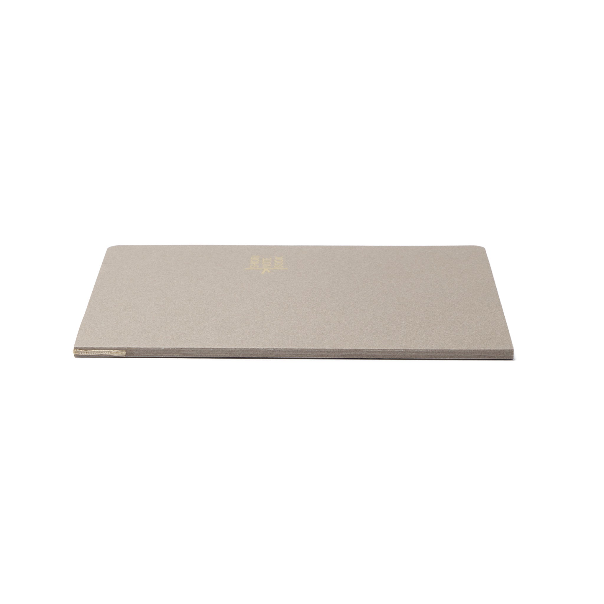 A side profile of the closed Pensift Notebook Refill, showing the slim 80-page spine and how the bookmark ribbon is built directly into the binding.